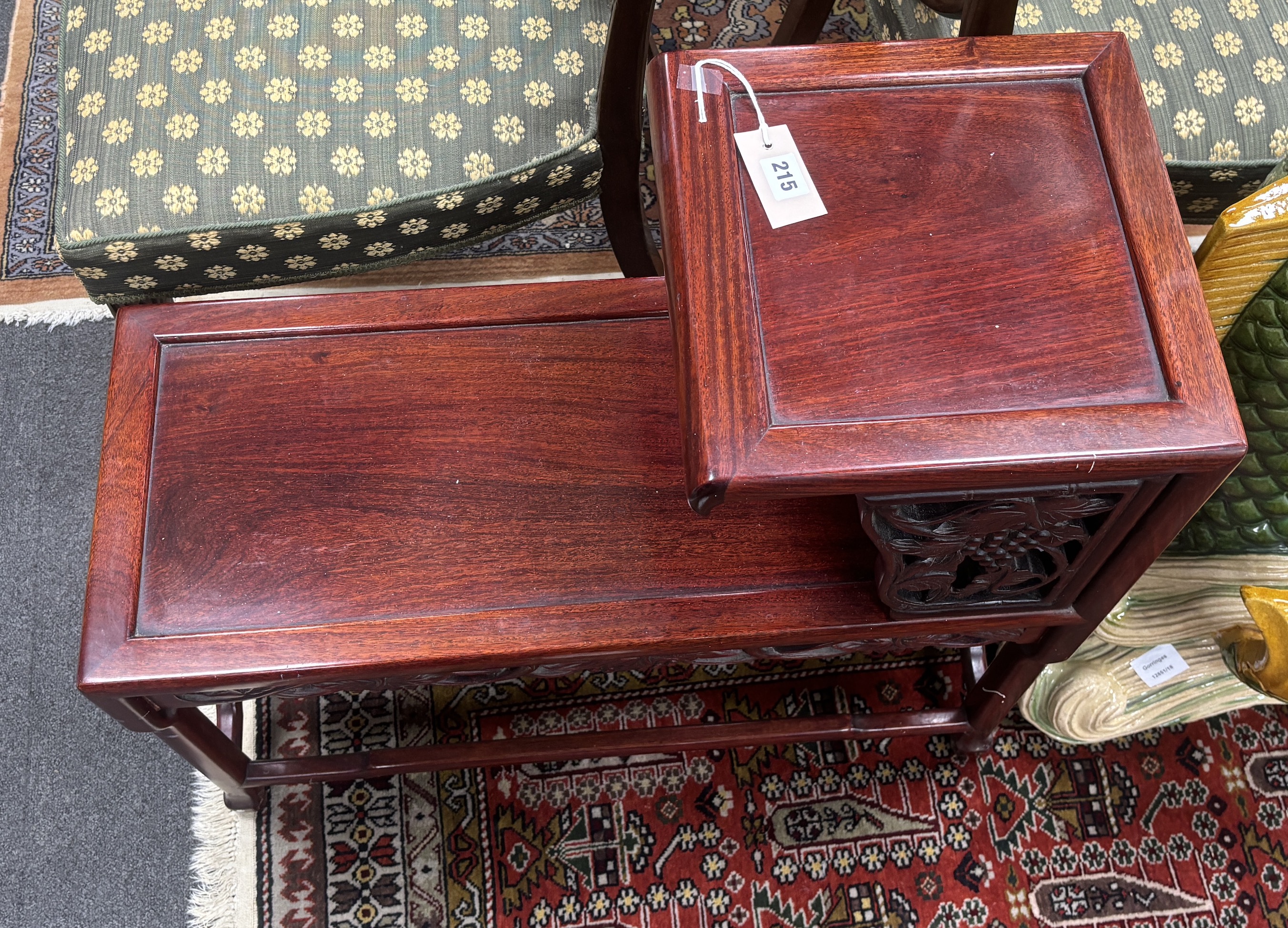 A Chinese carved hardwood two tier table, width 71cm, depth 30cm, height 66cm